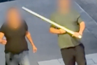 Man wielding samurai sword fought off by bystanders with spirit level