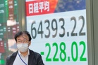Asian shares retreat after strong profits lead a rally on Wall Street