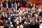 Fists fly in Albanian parliament as protests continue to roil the country