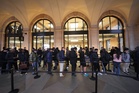 Apple fans brave Storm Austen to queue for release of iPhone Duo in London