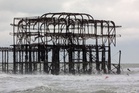 Part of historic Brighton pier collapses as storms bring heavy disruption