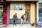 Shop owners in France board up windows ahead of weekend protests