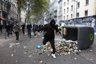 French shopkeepers take up guns and crowbars amid fears of further riots