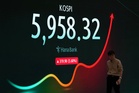 Asian stocks rise after a rally on Wall Street, while oil prices edge higher