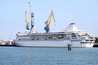 A US cruise ship ends a global voyage in Asia due to fuel costs and 200 passengers lose their homes
