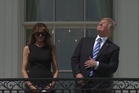 White House appears to troll Trump on eclipse day by sharing iconic picture of president staring at the sun