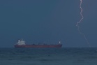 Iran’s navy tells ships Strait of Hormuz shut again, two vessels report gunfire