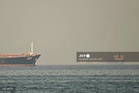 Trade ships hit in Hormuz as Iran reopening falters
