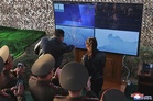 North Korea tests cluster bomb missiles, supervised by Kim Jong Un