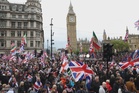 Tens of thousands turn out for UK far-right rally, counter demo
