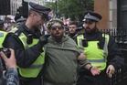 UK police arrest 32 at rival London protests