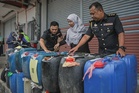 Eatery worker held for smuggling 840 litres of petrol