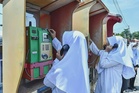 Local teacher urges schools to bring back public phones