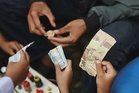Rupiah weakens past 17,700 as IHSG opens lower