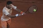 Djokovic fights through at French Open, Rybakina dumped out