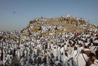 Pilgrims pray on Mount Arafat at hajj climax