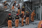 Rescuers race to find survivors after Philippines building collapse