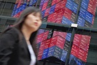 Asian stocks dip on AI fears and Middle East worries