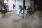 Protesters burn US flags, clash with riot police after Colombia vote
