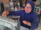 Seamstress born without fingers sews a life of independence