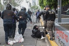 Police, protesters clash outside maiden World Cup match in Mexico