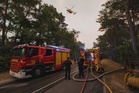 Wildfires advance near Paris as France marks national day