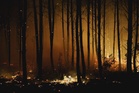 Wildfires force thousands to flee across southern Europe