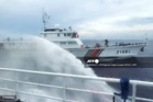Philippines hit by Chinese water cannon at disputed reef