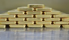 Gold edges higher as markets await Fed minutes