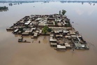 Flooding forces residents to flee homes by boat in Pakistan