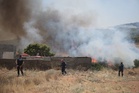 Greeks survey damage left by wildfires near Athens