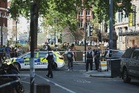 Woman charged after four stabbed in central London