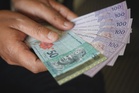Ringgit opens higher versus greenback on upbeat GDP data