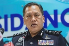 Malaysian man freed in Pakistan scam raid returns home