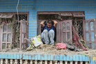 Nepal flood survivors return to ruins to salvage memories