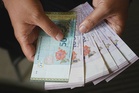 Ringgit opens mixed as US dollar strengthens on oil prices