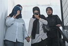 Two women charged with cheating retiree in tax scam
