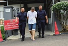 Used car dealer claims trial to illegal firearm possession charge