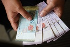 Ringgit opens firmer vs US dollar after BNM holds OPR