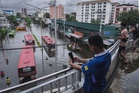 Bangkok floods: Thousands seek shelter as heavy downpours inundate capital