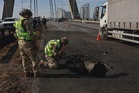 Russian strikes hit Kyiv while Germany’s Merz visits