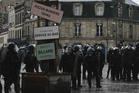 France suspends stun grenades after 15-year-old loses hand at protest