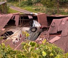 4WD lands on house after dramatic roadside skid