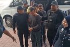 Empat lelaki didakwa bunuh peniaga