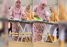 [VIDEO] Guru gosok baju calon SPM basah kena hujan