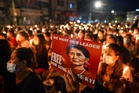 Behind barbed wire, Suu Kyi’s Yangon villa shows no sign of life after house arrest move