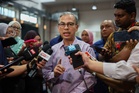 Pardon? Fahmi says Jho Low must face justice in Malaysia over 1MDB
