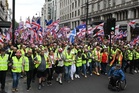 ‘Make England Great Again’: Tommy Robinson rally draws tens of thousands amid rival London protests