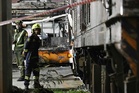 Thai authorities charge bus and train drivers after deadly level crossing collision in Bangkok