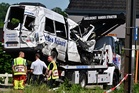 Four killed after train crashes into school minibus at Belgian rail crossing